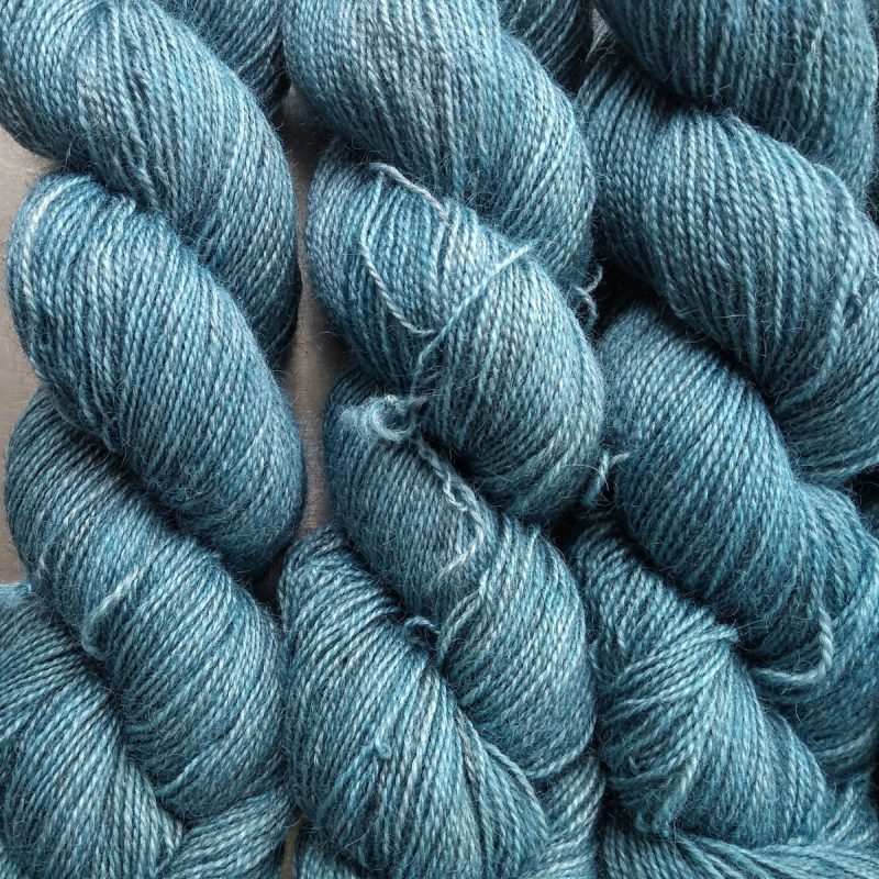 Hama's Hall - Light grey-blue Bluefaced Leicester (BFL) / Gotland / Wensleydale 4-ply (fingering) weight high-twist sock yarn. Hand-dyed by Triskelion Yarn