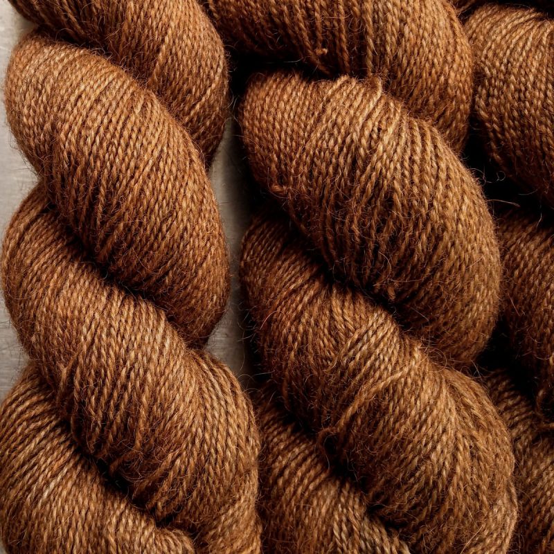 Marten - Mid-tone russet brown Bluefaced Leicester (BFL) / Gotland / Wensleydale 4-ply (fingering) weight high-twist sock yarn. Hand-dyed by Triskelion Yarn