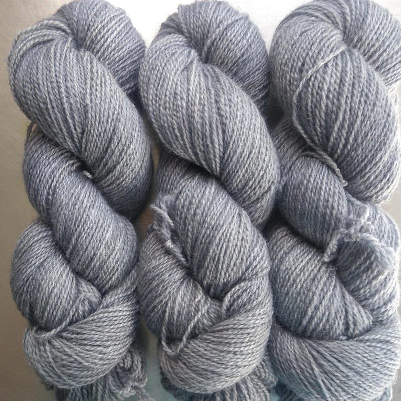 Fenrir - Mid tone cool grey Bluefaced Leicester (BFL) / Gotland 4-ply (fingering) yarn. Hand-dyed by Triskelion Yarn