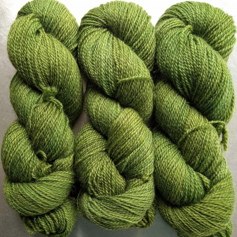 Gerda - Mid tone grassy green Bluefaced Leicester (BFL) / Gotland 4-ply (fingering) yarn. Hand-dyed by Triskelion Yarn