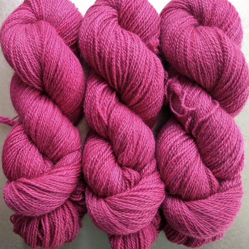 Yves Rose - Intense mid to dark rose Bluefaced Leicester (BFL) / Gotland 4-ply (fingering) yarn. Hand-dyed by Triskelion Yarn