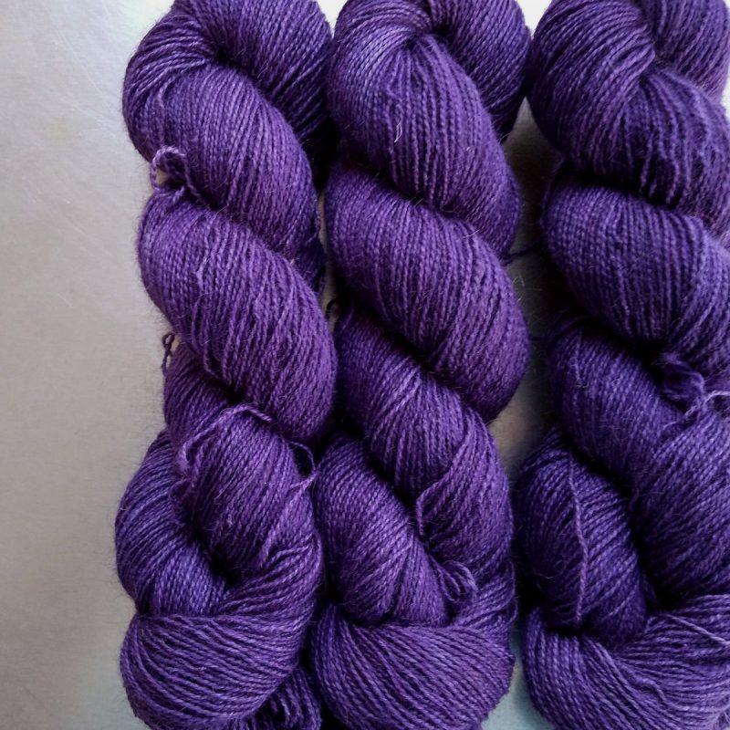 Saxnot - Semi-solid mid-tone purple Bluefaced Leicester (BFL) / Gotland / Wensleydale 4-ply (fingering) weight high-twist sock yarn. Hand-dyed by Triskelion Yarn