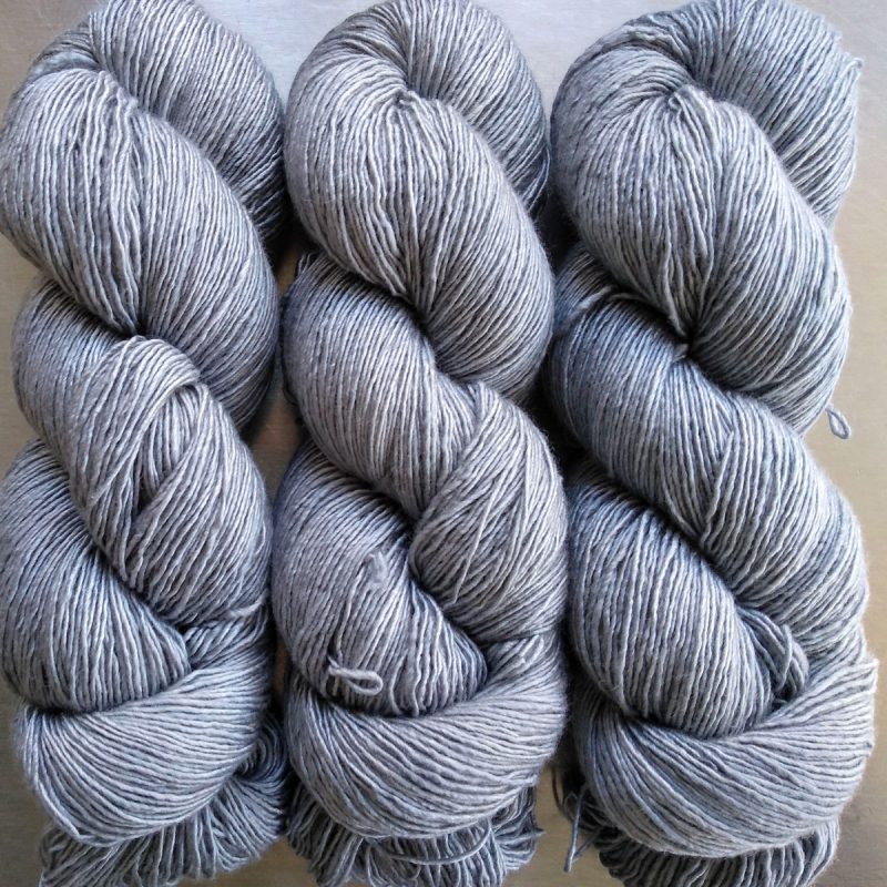 Fenrir - Mid tone cool grey Falklands Merino and silk blend yarn. Hand-dyed by Triskelion Yarn.