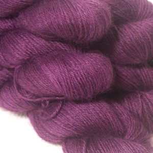 Tyrian Purple - Dark reddish purple hand-dyed Wensleydale DK/ Double Knit yarn. Hand-dyed by Triskelion Yarn