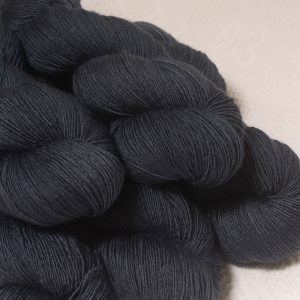 Charcoal - Charcoal grey Falklands Merino and silk blend yarn. Hand-dyed by Triskelion Yarn.