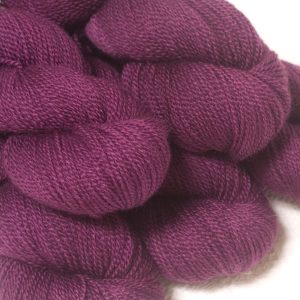 Tyrian Purple - Dark reddish purple Bluefaced Leicester sport weight yarn hand-dyed by Triskelion Yarns