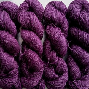 Tyrian Purple - Dark reddish purple Bluefaced Leicester (BFL) / Gotland / Wensleydale 4-ply (fingering) weight high-twist sock yarn. Hand-dyed by Triskelion Yarn