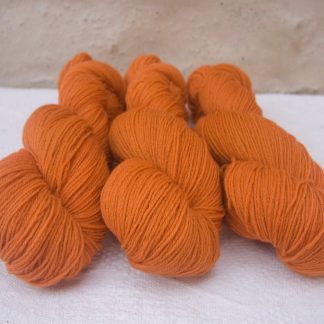 Arcturus - Fresh light to mid orange 4-ply/fingering Peruvian Highland wool sock yarn. Hand-dyed by Triskelion Yarn.