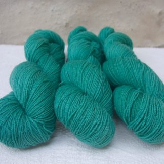 Fionnuala - Light to mid-tone teal green 4-ply/fingering Peruvian Highland wool sock yarn. Hand-dyed by Triskelion Yarn.