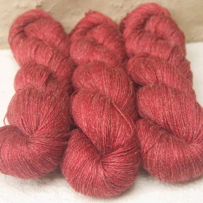 Boötes - Mid- to dark red Baby Alpaca, silk and linen heavy laceweight yarn. Hand-dyed by Triskelion Yarn.