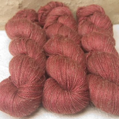 Rose - Vibrant deep rose Baby Alpaca, silk and linen heavy laceweight yarn. Hand-dyed by Triskelion Yarn.