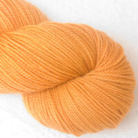 Anemone - Apricot orange Corriedale 4-ply/fingering weight yarn. Hand-dyed by Triskelion Studio.