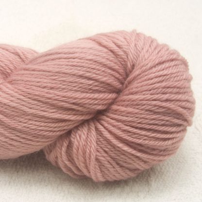 Rhosyn – Soft, dusty pink, on the rose side Corriedale heavy DK/worsted weight yarn. Hand-dyed by Triskelion Studio.