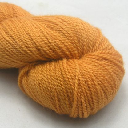 Anemone - Light orange with a yellow undertone Bluefaced Leicester sport weight yarn hand-dyed by Triskelion Yarns