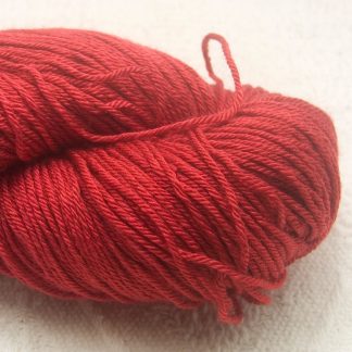 Boötes - Mid- to dark red Merino and silk blend 4-ply / fingering weight yarn. Hand-dyed by Triskelion Yarn.