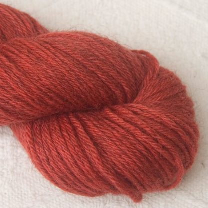 Beach Hut - Light scarlet red Bluefaced Leicester (BFL) / Gotland aran weight yarn. Hand-dyed by Triskelion Yarn