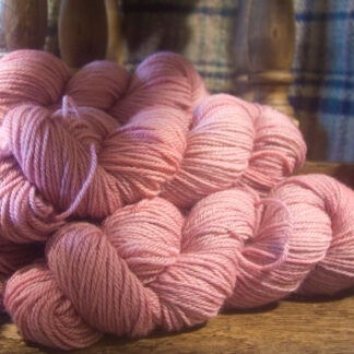Coconut Ice - hand-painted semi-solid soft pink Bluefaced Leicester worsted weight yarn hand-dyed by Triskelion Yarn